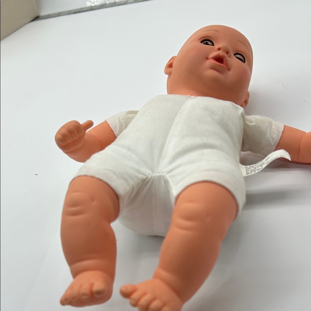Realistic Baby Doll with White Outfit